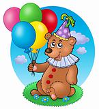 Bear clown with balloons on meadow
