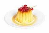 Cream caramel dessert with red currants