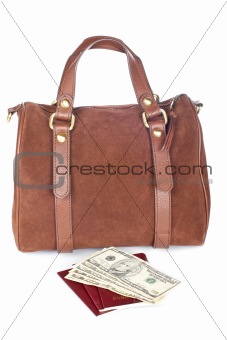 Brown handbag with two passports and money