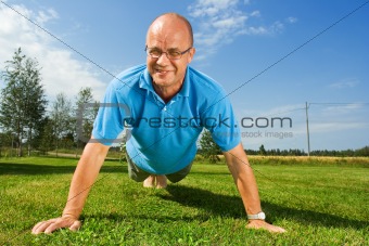 Older man doing push-ups
