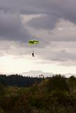 Tandem Paragliders Decending onto Ground