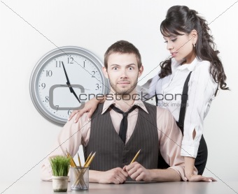 Man receiving attention from a pretty coworker