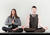 Two businessmen meditating