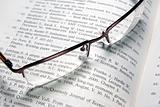 Glasses laying on book.