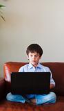 Kid using his laptop