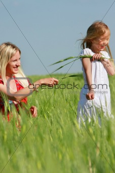 happy mother and daughter outdoors