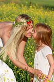 loving mother and daughter on nature