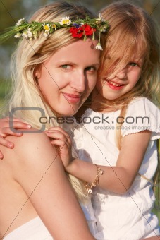 loving mother and daughter outdoors portrait