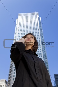 Beautiful Oriental Girl On Her Cell Phone In the City