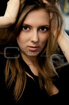 Portrait of beautiful young woman with long hair