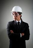 Young mixed race man in hard hat and safety goggles