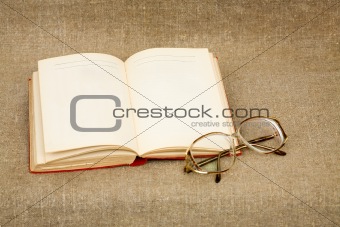 Ancient book and spectacles