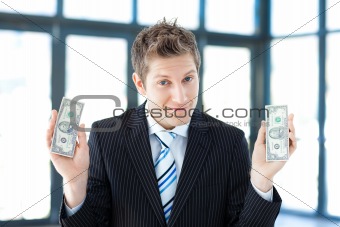 Businessman holding dollars
