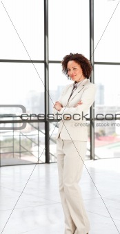 Attractive businesswoman with folded arms