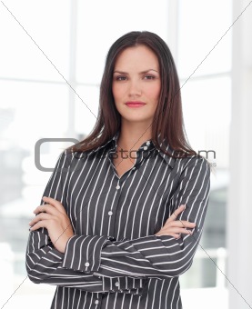 Young businesswoman with folded arms