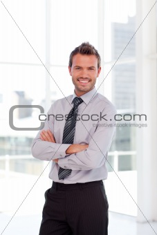 Handsome businessman smiling at the camera