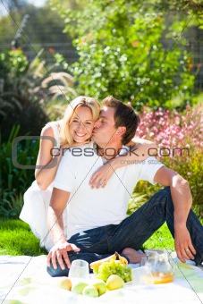 Couple having picnic in a park