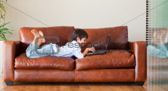 Young kid playing with a laptop