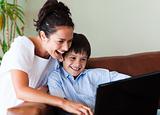 Mother and son having fun with a laptop