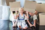Happy family moving house lying on floor