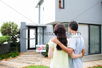 Newlyweds with their new house