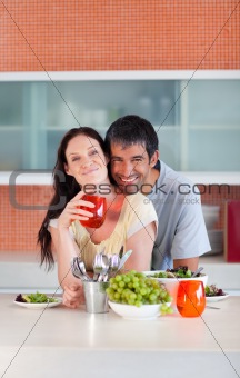 Lovers eating in the kitchen
