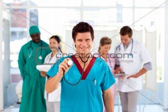 Doctor with colleagues in the background
