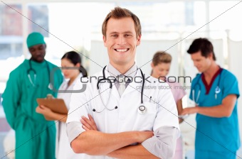 Doctor with colleagues in the background