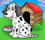 Dalmatian dog in front of kennel