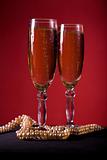 Champagne glasses with pearl necklace 