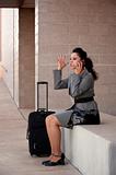 Angry Hispanic Woman Traveler Talking on Cell Phone