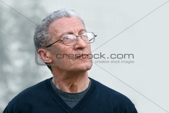 A senior man looking up