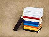 Multicolor books on the fabric background