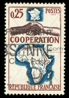 vintage French stamp depicting a black and white man shaking hands