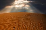 sky split over the desert sand