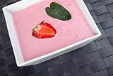 strawberry curd with a peppermint leaf
