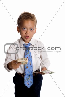 Young boy dressed as businessman holds money - isolated on white