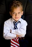 A portrait of young boy wearing US flag necktie