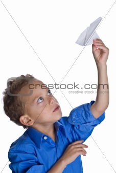 Young boy with paper plane