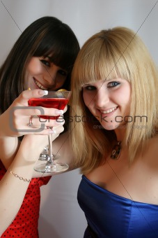 Two pretty friends with cocktail