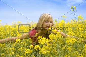 smelling yellow flowers