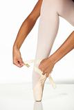 Tying ballet shoes