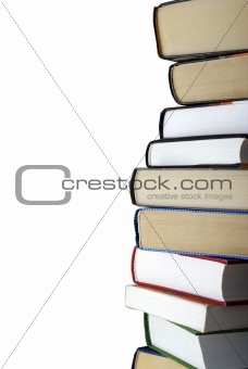 Vertical stack of different books isolated on white background. Clipping path.