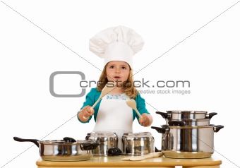 Little girl dressed as a chef having fun