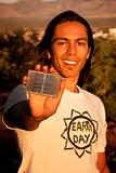 Handsome young man with small solar panel