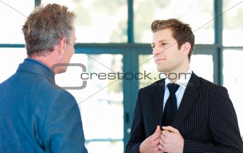Young businessman talking to a senior manager