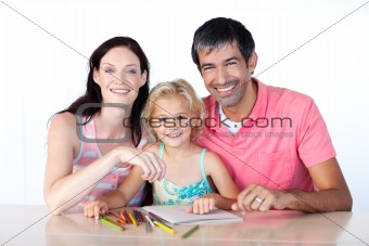 Parents and daughter drawing