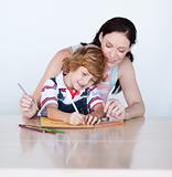 Son and mother drawing together