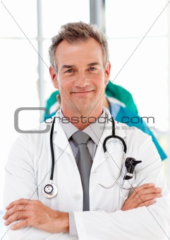 Senior doctor with folded arms