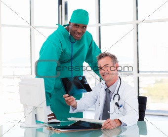 Senior doctor and young surgeon studying an X-ray